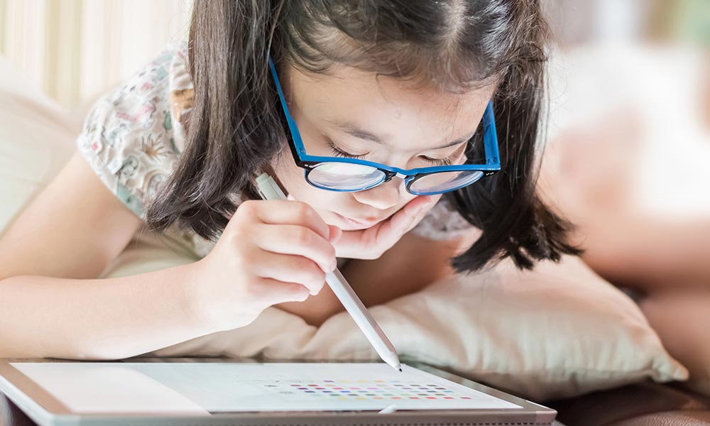 A girl working on a tablet