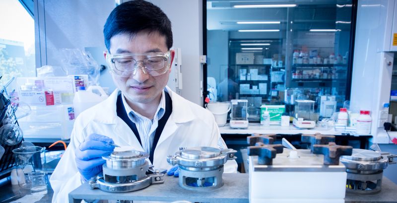 Huanting working in the lab