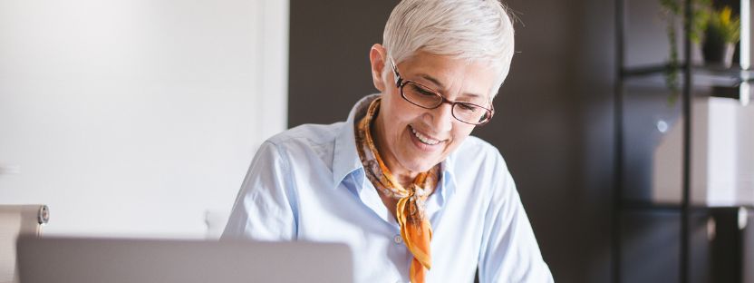 female professional at desk 832x312.jpg