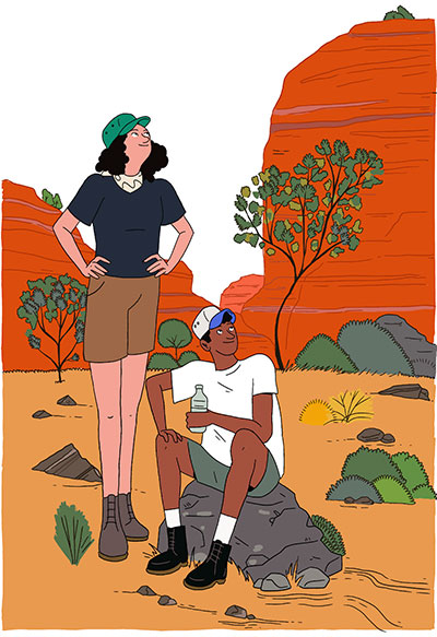 people hiking in the red desert