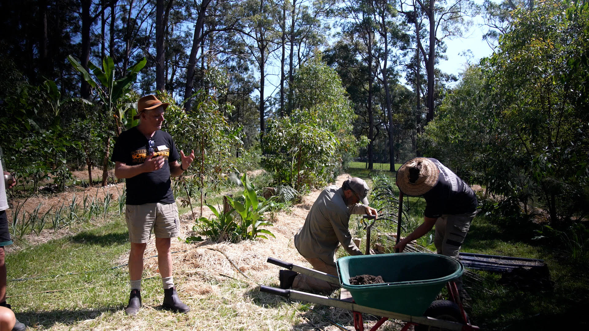 Photo of Chaffin Creek Farm with farmers preparing a garden plot