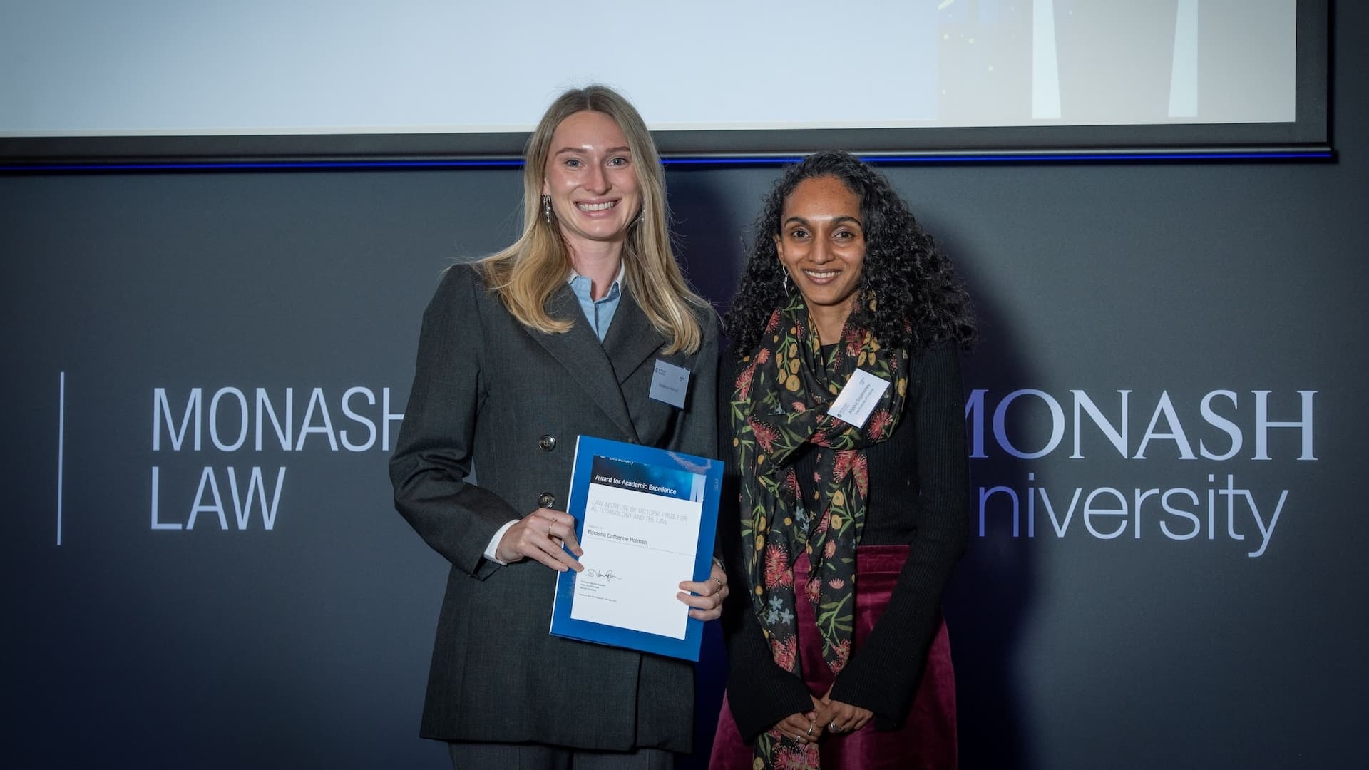Natasha Holman accepts her prize from Alyss Sigamoney of Law Institute of Victoria.
