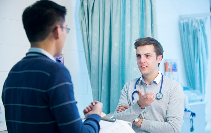 doctor talking to patient in hospital