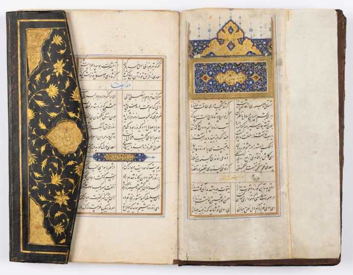 An open book filled with decorative, flowing scripts and framed with colourfully illustrated borders and linework