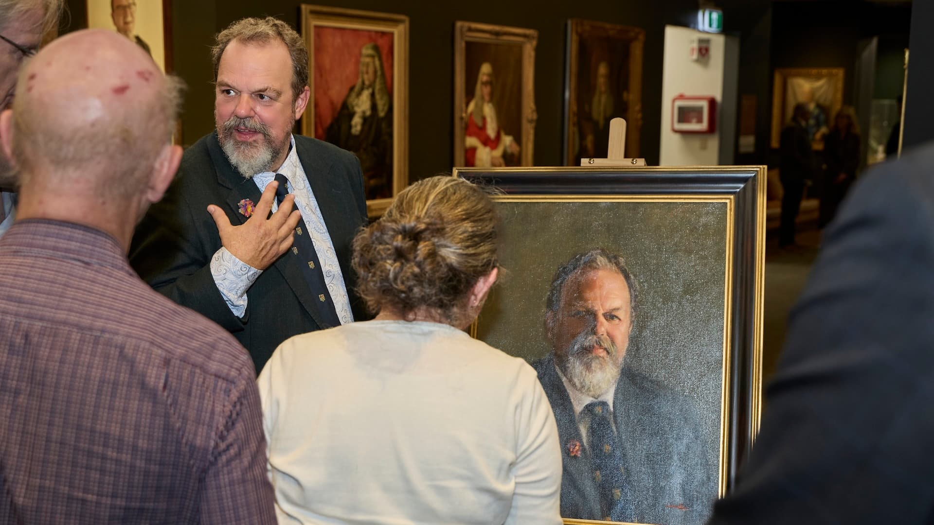 Arnold Dix with guests at the unveiling of his portrait in the Victorian Bar gallery
