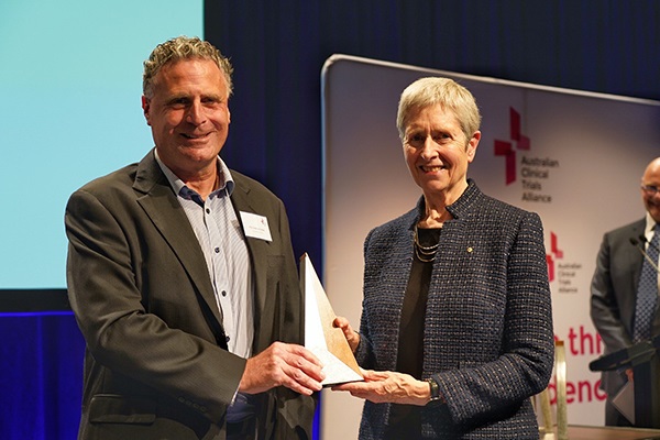 Professor Andrew Forbes accepting his Award from NHMRC CEO Professor Anne Kelso AO