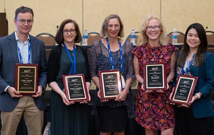 Dr Dan Malone, Professor Kirsten Galbraith, Marian Costelloe, Professor Tina Brock and Dr Vivienne Mak holding their AACP awards