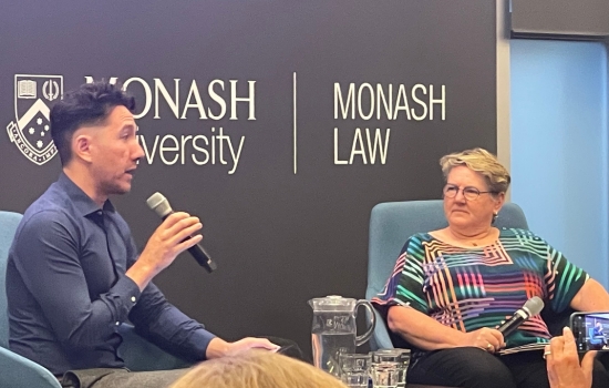 Sav Tanhchareun and Paula Gerber seated in conversation on stage