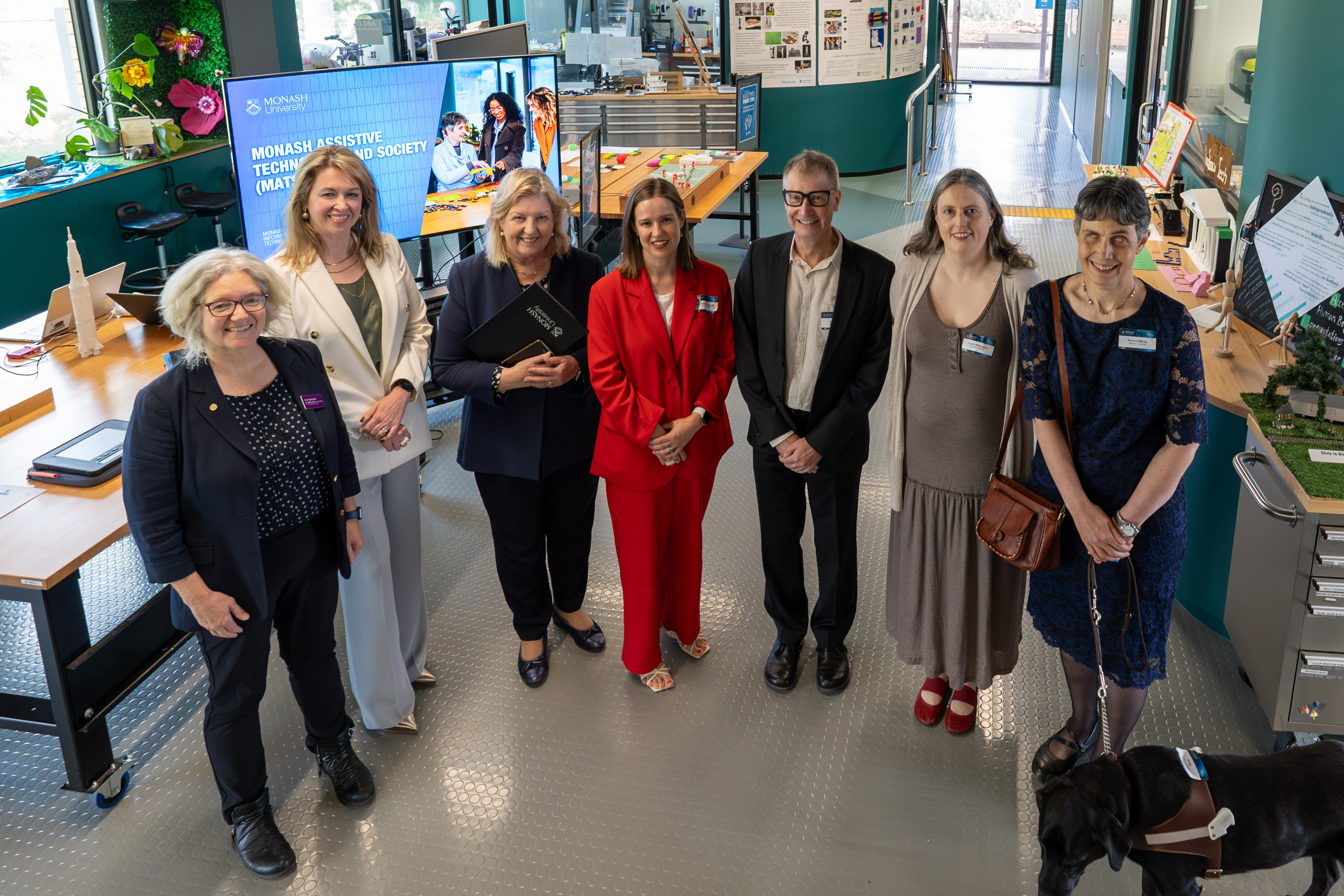 Overhead photograph of MATS team members and VIP visitors in the maker lab at the MATS launch event