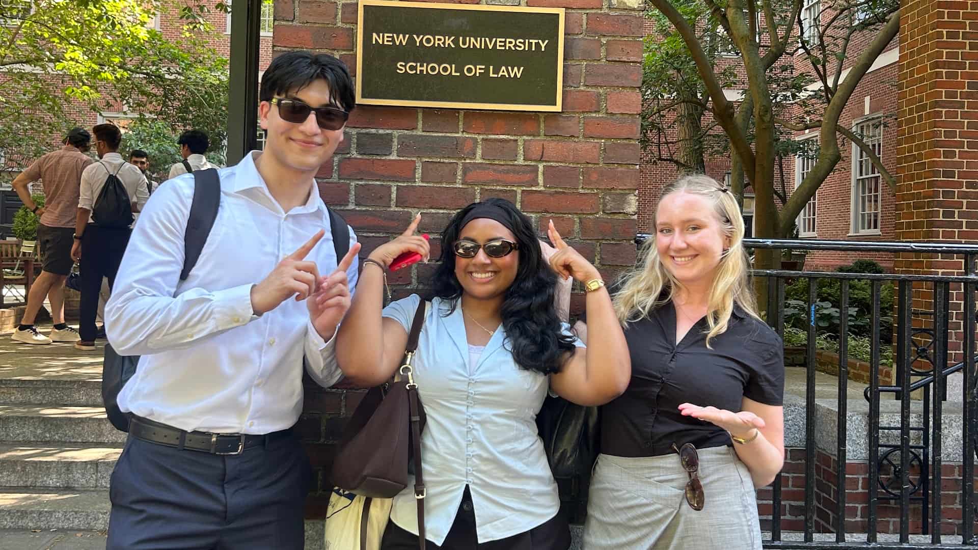 Raheel, Kenuli and Lola in front of NYU Law Building