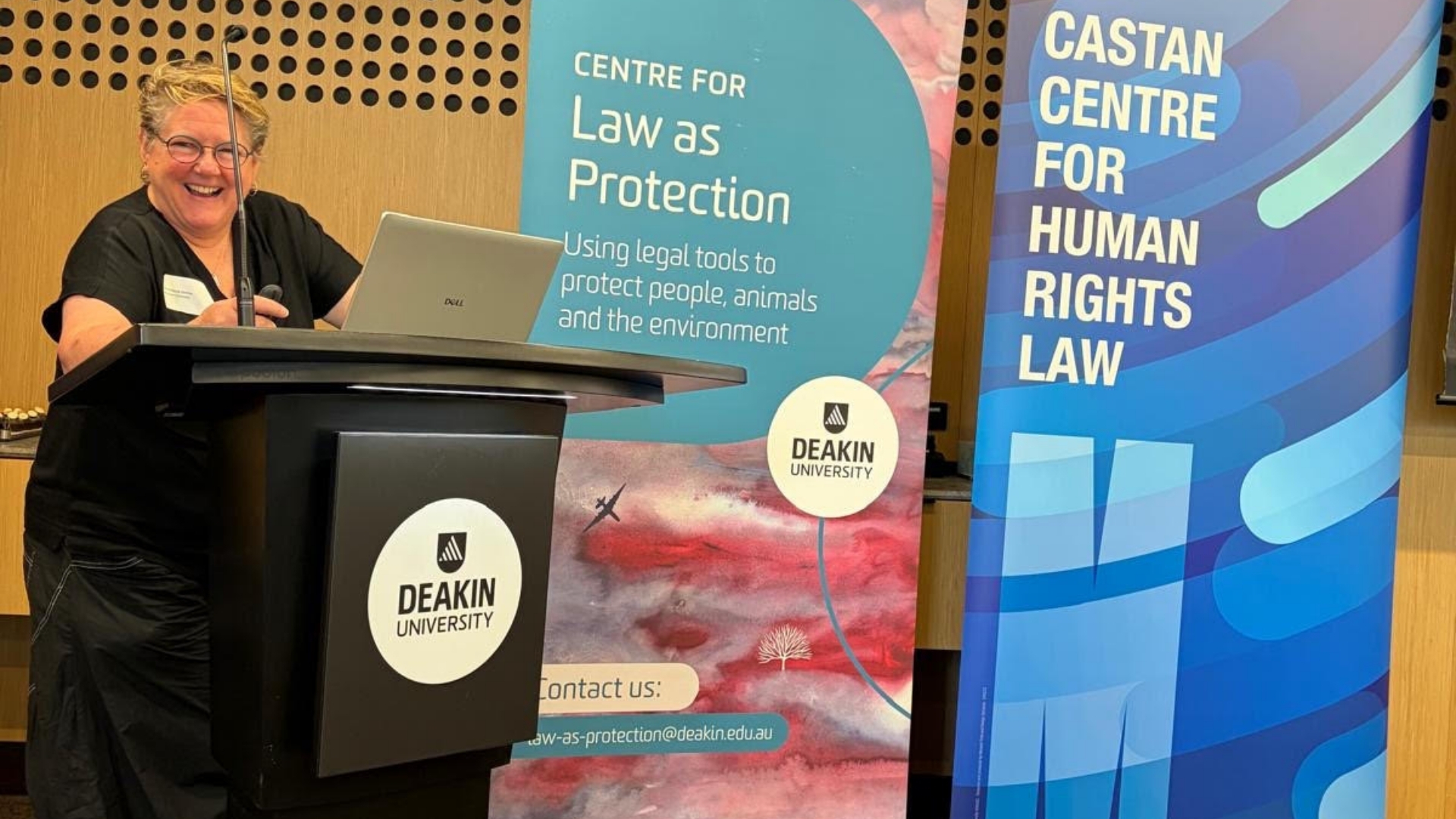 Paula Gerber talking at the lectern.