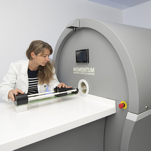 Dr Karen Alt with MPI scanner