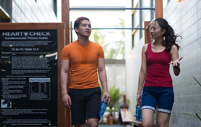 two people walking and talking after a taking a run