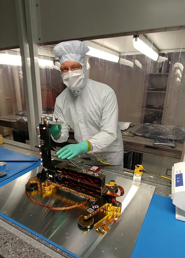 Mark Fittock adjusting to part of Mars lander
