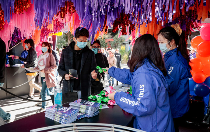 Student ambassadors handing out swags on Open Day