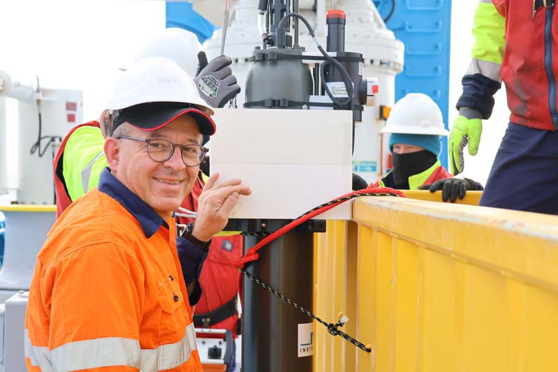 Scientists close up with Argo float