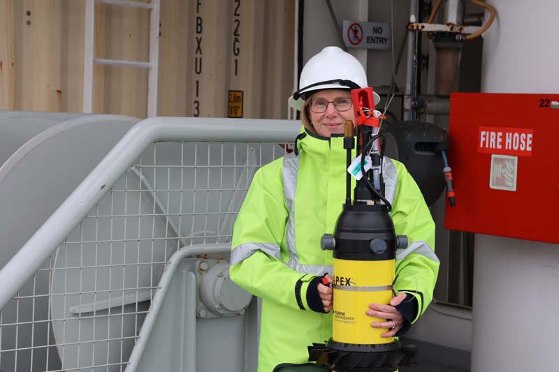 Scientist holding VM apex float