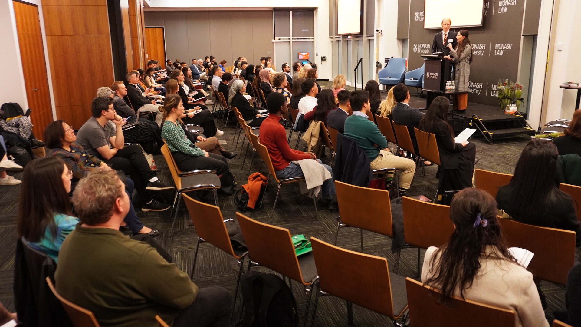 Monash Law alumni Helen Dosky and Campbell Russell speaking at the launch of the Handbook on Universal Jurisdiction.