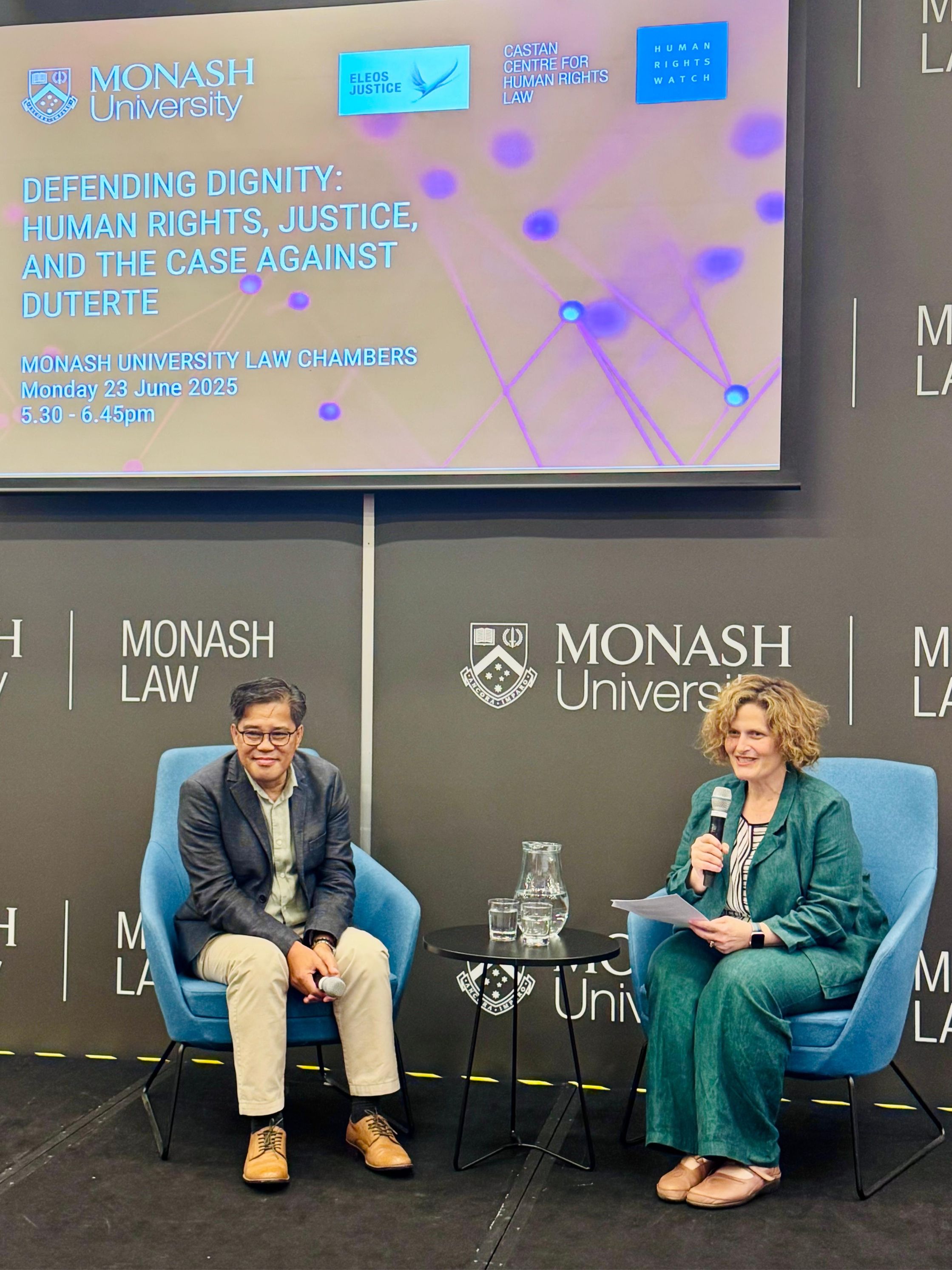Carlos H. Conde and Sara Kowal in discussion.