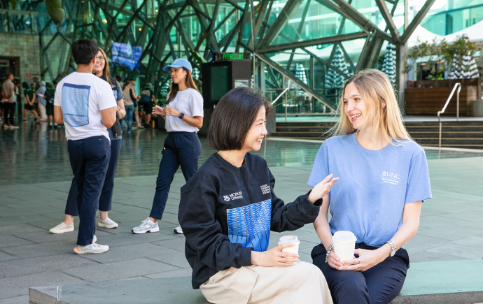 Fed Square group sitting down