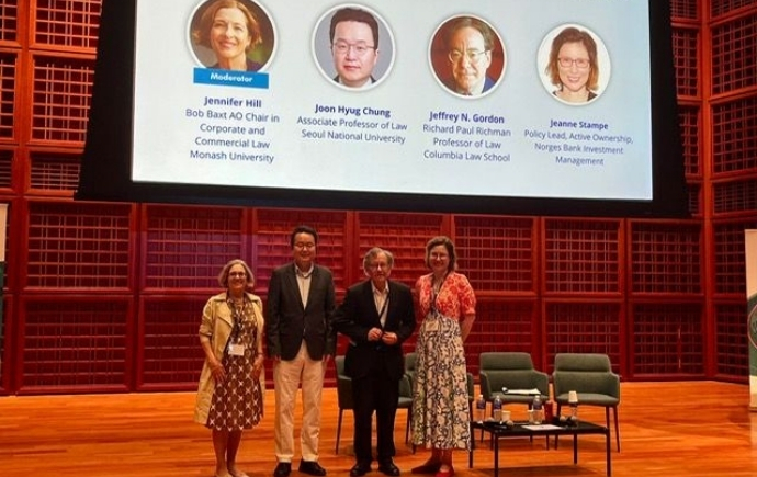 Photo of Professor Jennifer Hill and colleagues on stage for The Global Rebalancing of Corporate Governance Norms