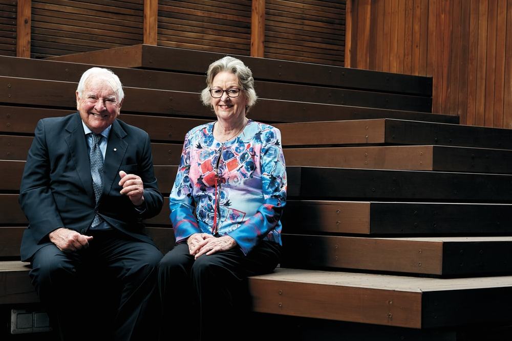John and Nariel Ware sitting on steps