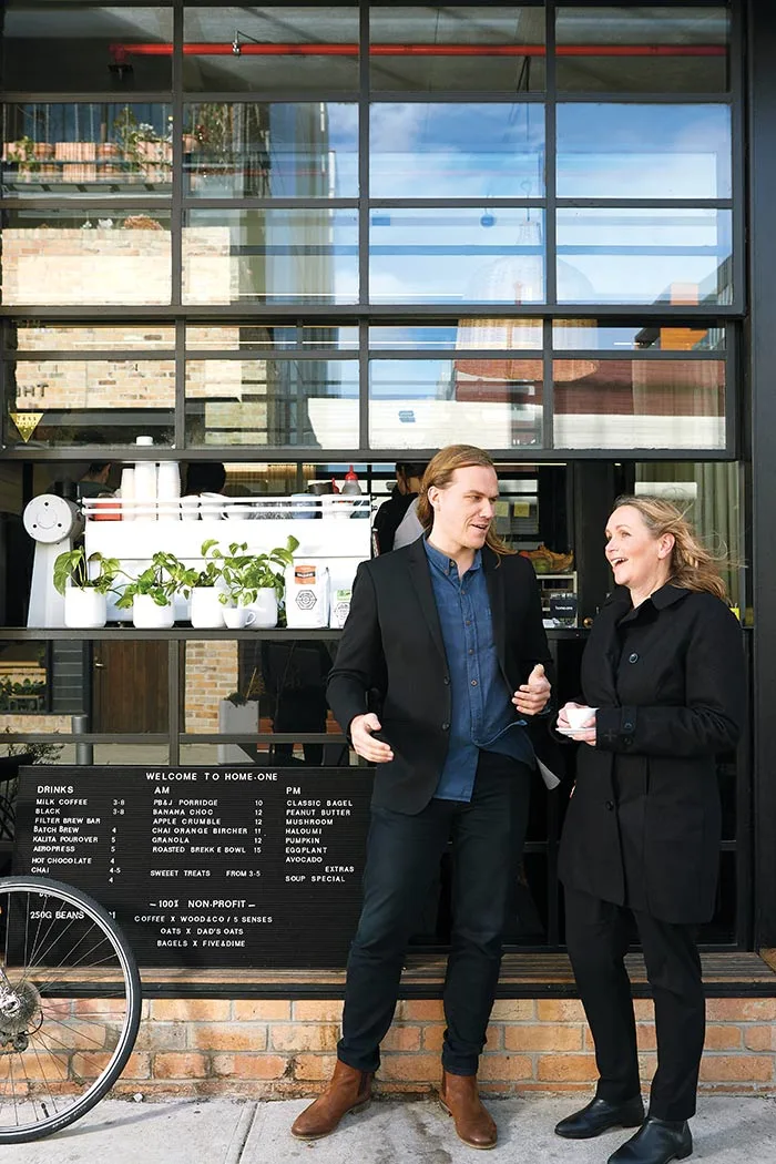 Di and Dan standing in front of coffee shop