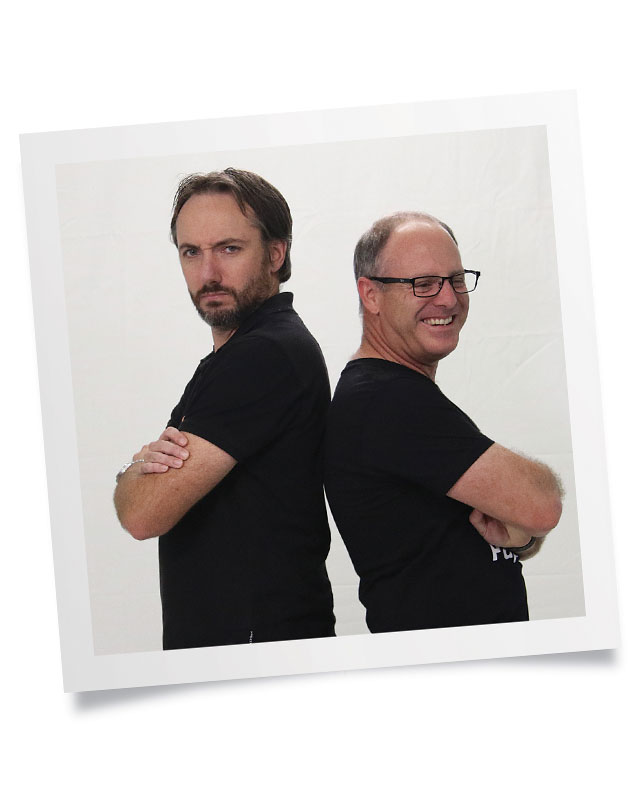 Matt Doran and Chris Dance leaning back to back with arms crossed