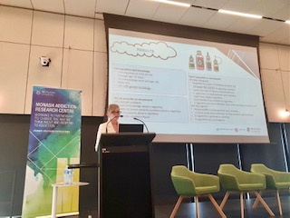 Melis giving a presentation the 2022 MARC symposium