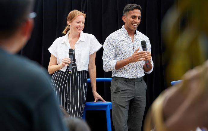 Two Monash experts presenting on stage