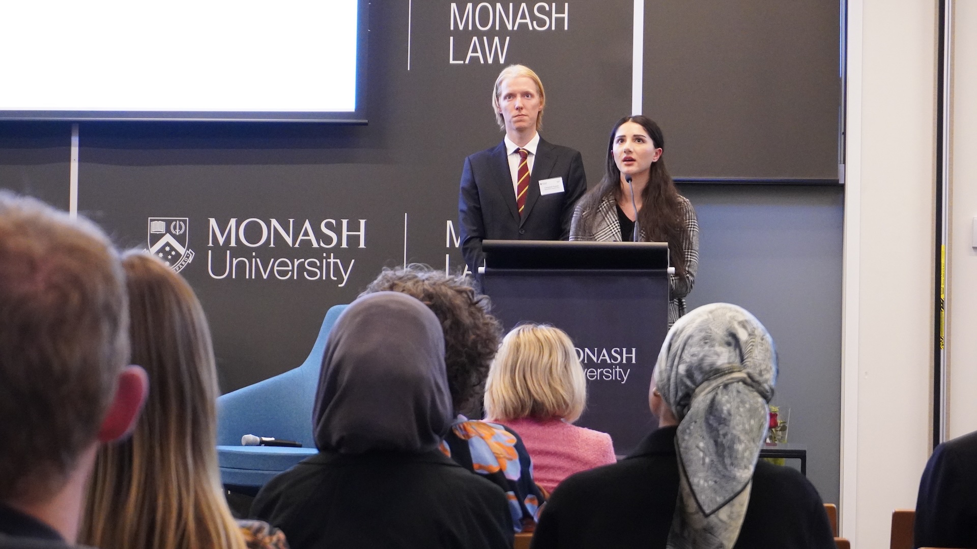 Monash Law alumni Helen Dosky and Campbell Russell speaking at the launch of the Handbook on Universal Jurisdiction.