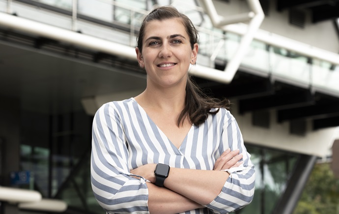 Dr Karolina Matuszek standing in front of the Green Chemical Futures building