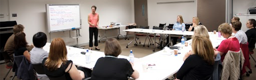 Presenter standing in front of audience