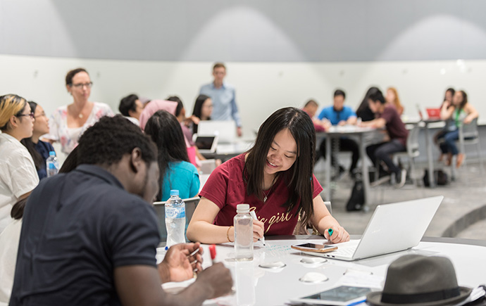 Students writing notes