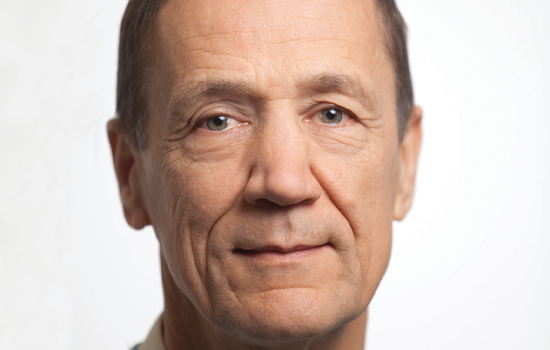 headshot of a man against a white background
