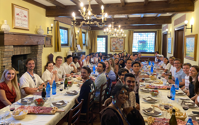 Students enjoying an Italian dinner.