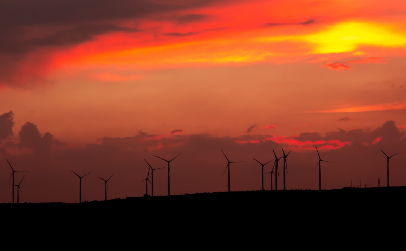 Sunset with wind turbines on the horizon