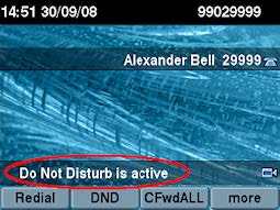 A desk phone screen showing the words ‘Do Not Disturb is active’