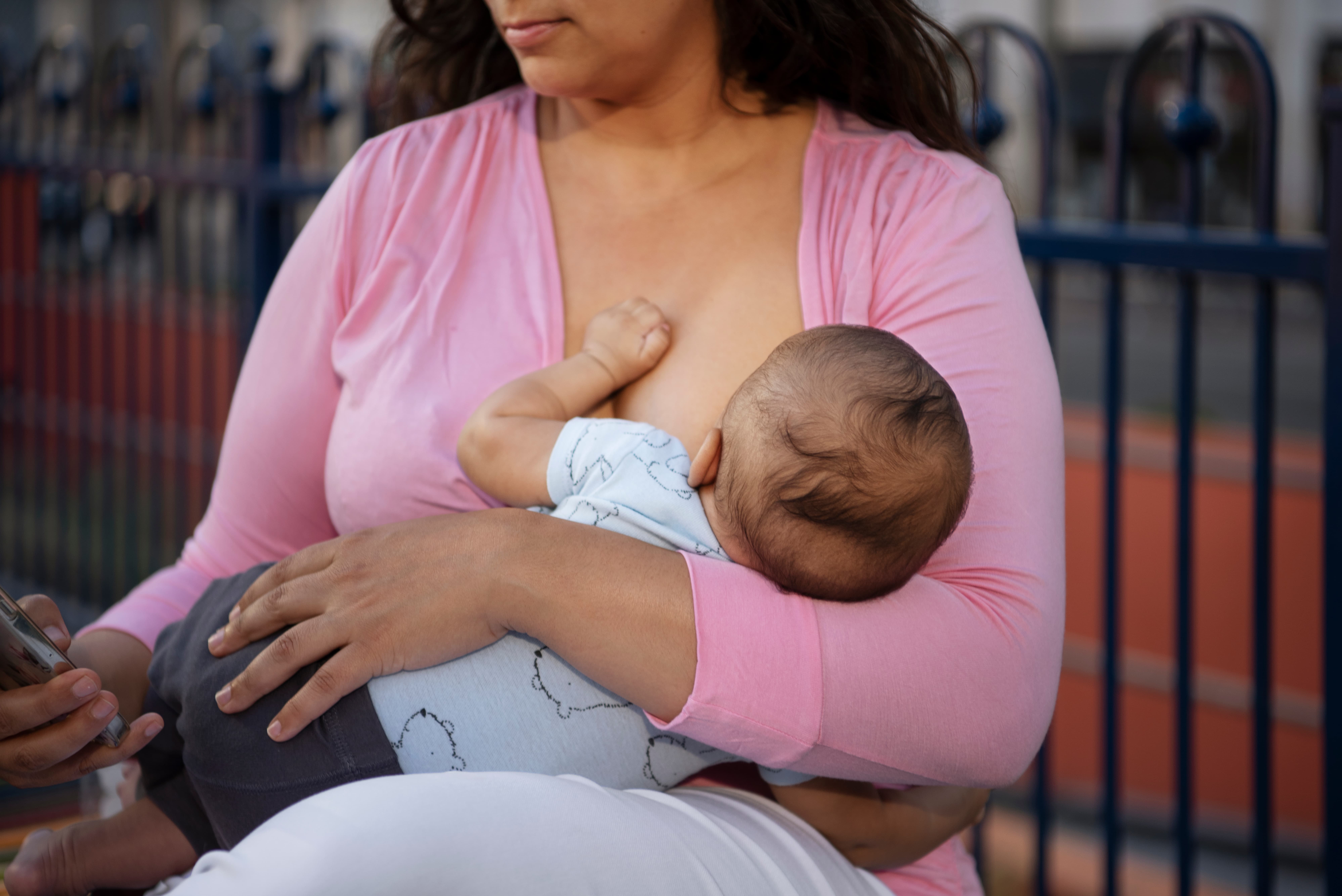 A picture of a mother breastfeeding a baby.