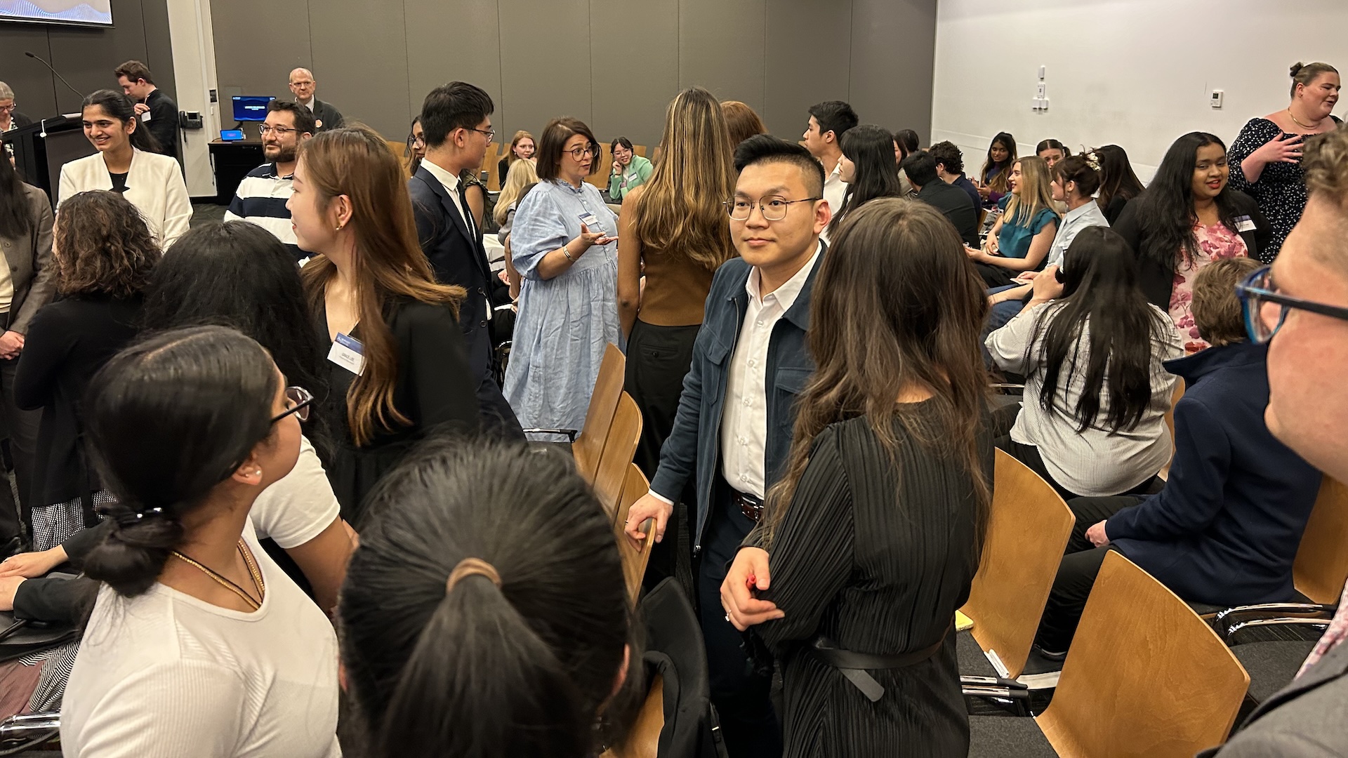 Surrounded by Law students, Madeline Oldfield gives the ‘Lawtitude’ team a pep-talk at the 2023 Law Ambassador Program showcase. 