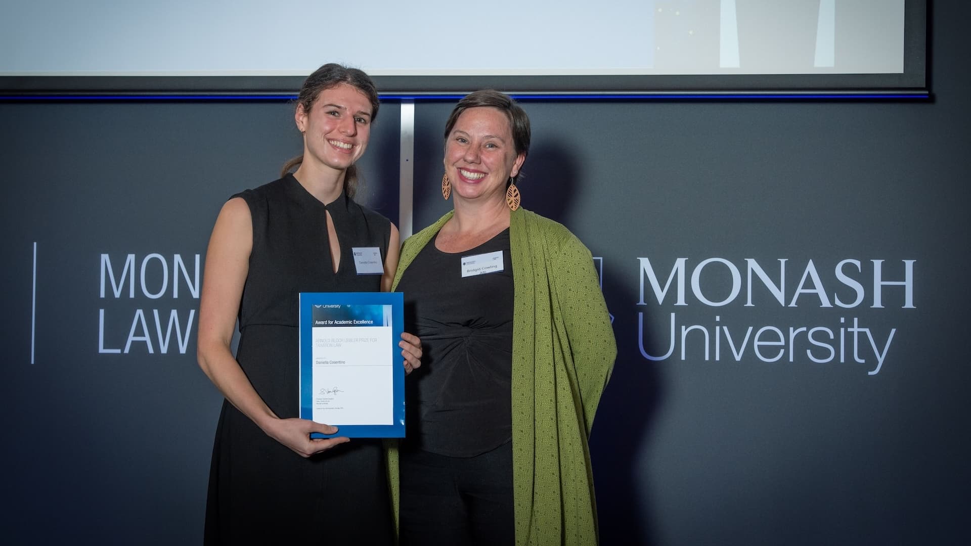 Daniella Cosentino accepts her prize from Bridgid Cowling of Arnold Bloch Leibler.