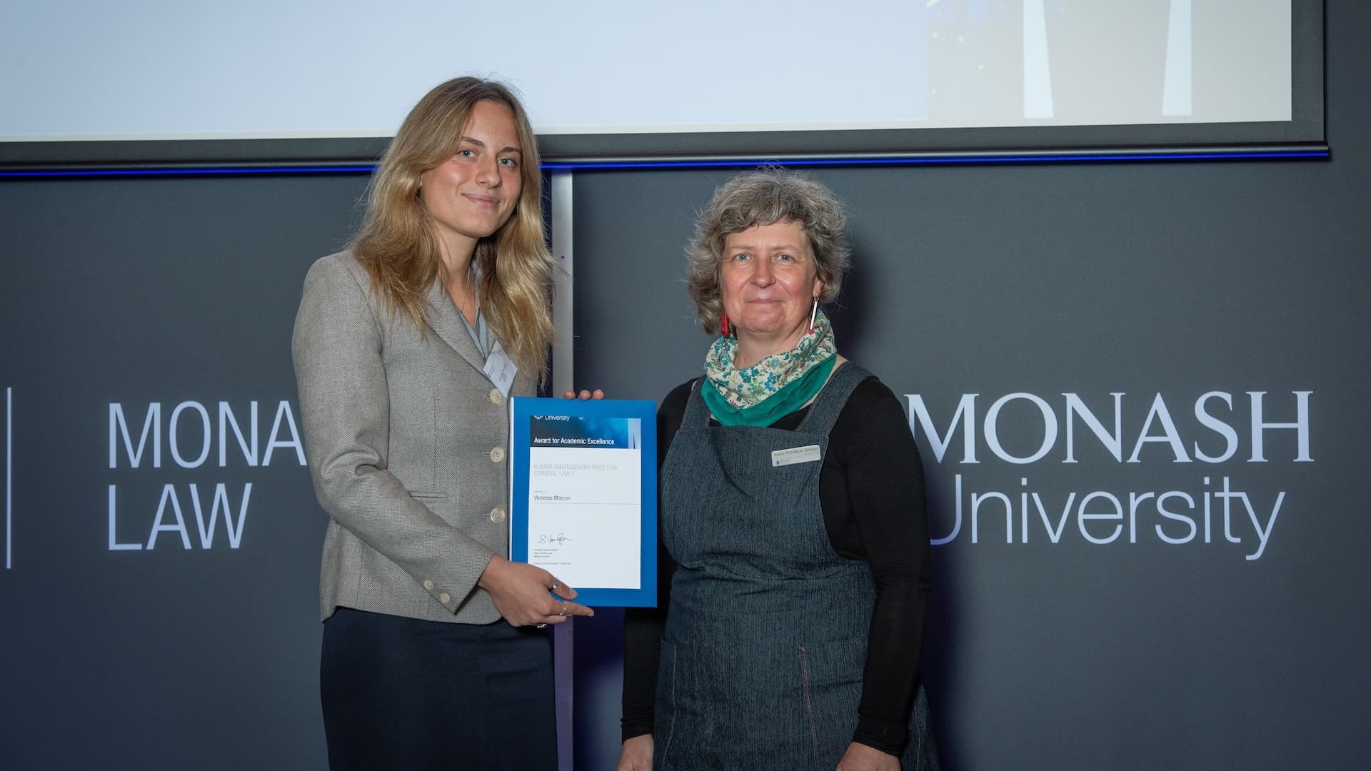 Vanessa Marcon accepts her prize from Associate Professor Becky Batagol.