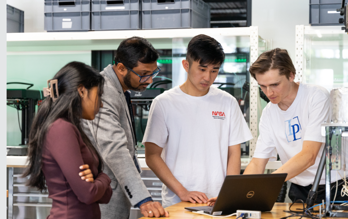 Dr Tanksale working with PhD students