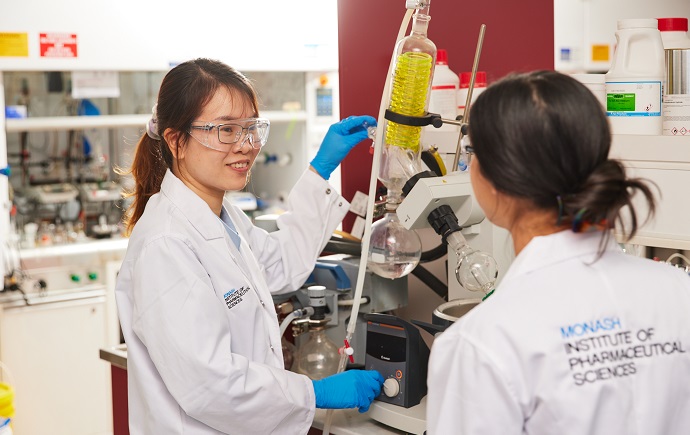 Two researchers working in a medicinal chemistry lab