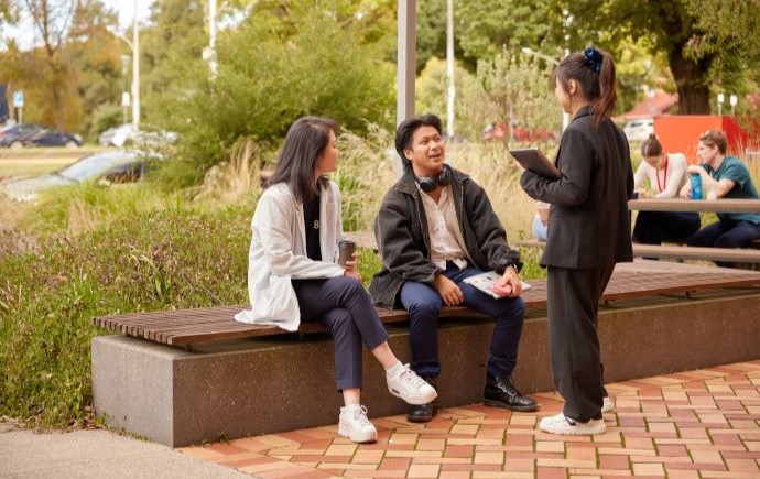 Students talking together at Monash Parkville campus