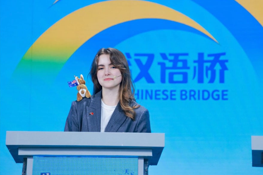 Ava speaking on stage