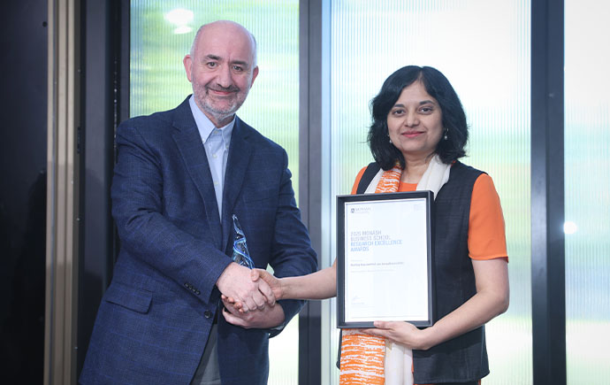 Prof Lata Gangadharan receiving her award.