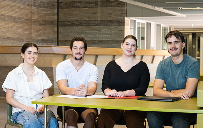 Lewis (far right) topped up his scholarship with a job in fundraising to help support other students like him.