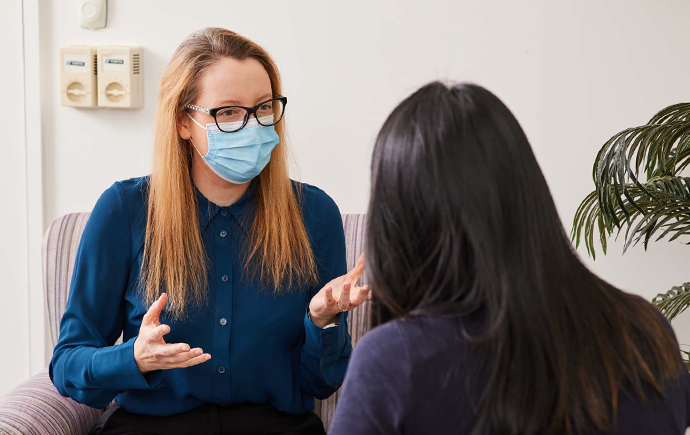 Emily Reeve talking to patient