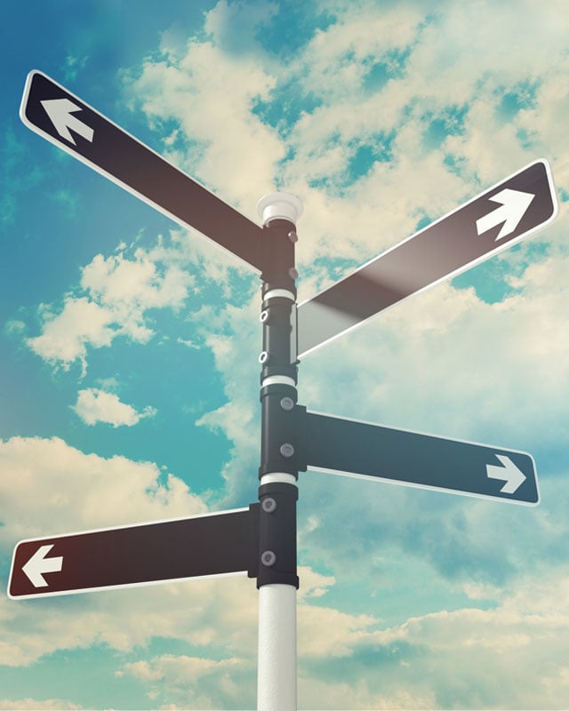 Street sign pointing in multiple directions